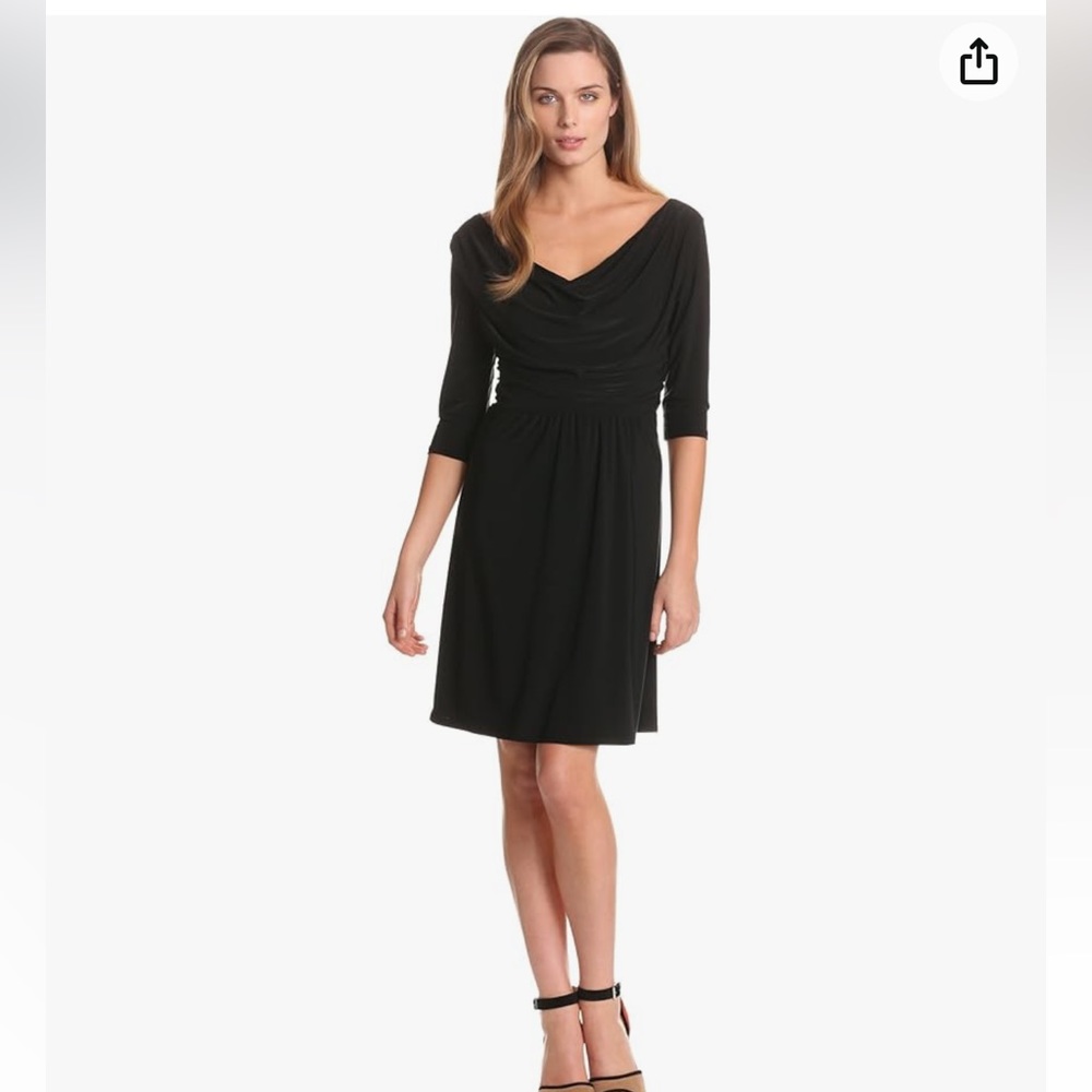 “B•Slim” fashionable black dress with 3/4 sleeves and very flattering.
